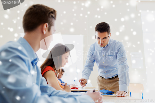 Image of group of students and teacher at school classroom