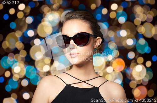 Image of beautiful young woman in elegant black sunglasses