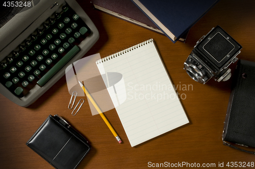 Image of Blank steno notepad on a desk among vintage journalism props