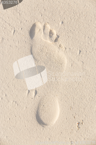 Image of Footprint in the sand.