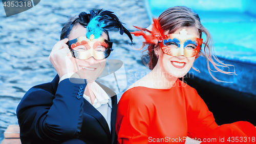 Image of Happy Man And Woman In Masquerade Masks