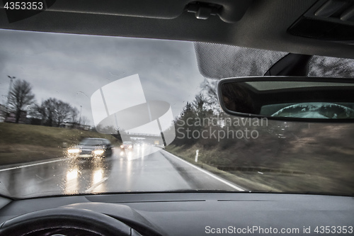 Image of View from a moving car in the rain