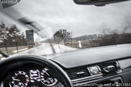 Image of View from a moving car in the rain