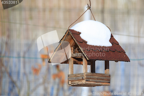 Image of birdhouse in winter garden