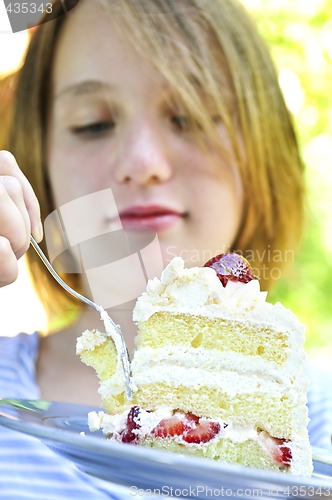 Image of Girl eating a cake