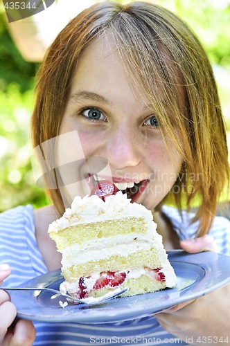 Image of Girl eating a cake