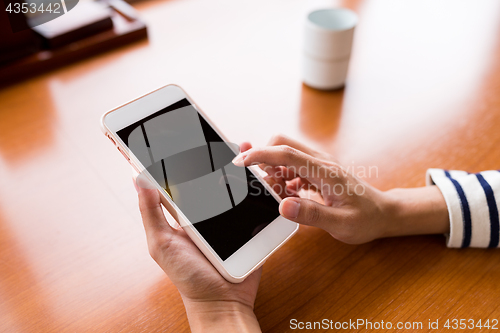 Image of Woman using cellphone