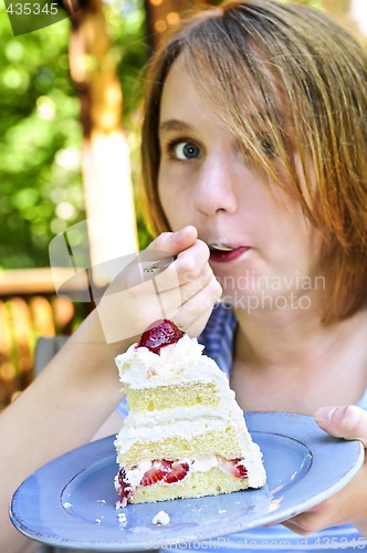 Image of Girl eating a cake