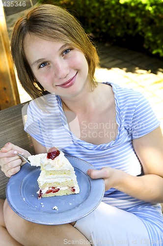 Image of Girl eating a cake