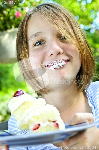 Image of Girl eating a cake