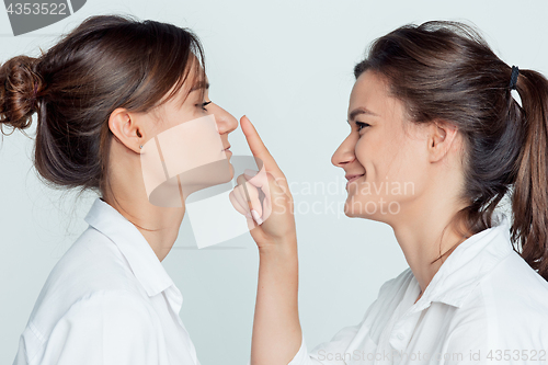 Image of Studio portrait of female twins