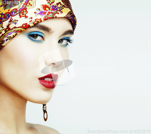 Image of young pretty modern girl with bright shawl on head emotional posing isolated on white background, asian people ethnicity