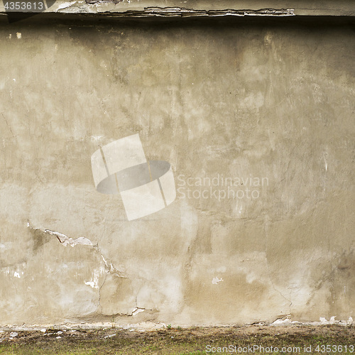 Image of abandoned grunge cracked stucco wall