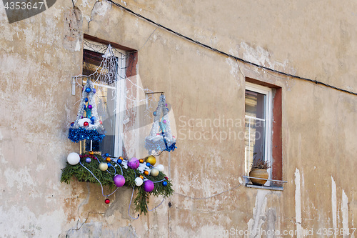 Image of Christmas decoration outside window on a house