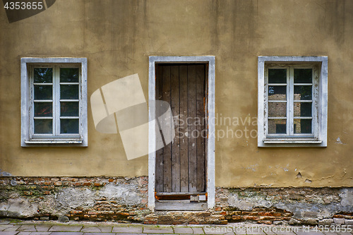 Image of Old windows and door with grunge cracked wall