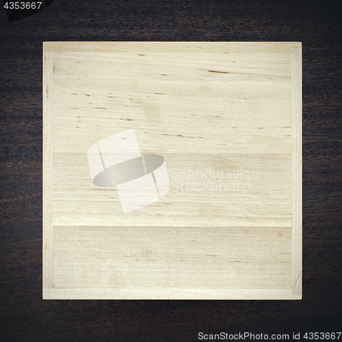 Image of White wooden box on dark background