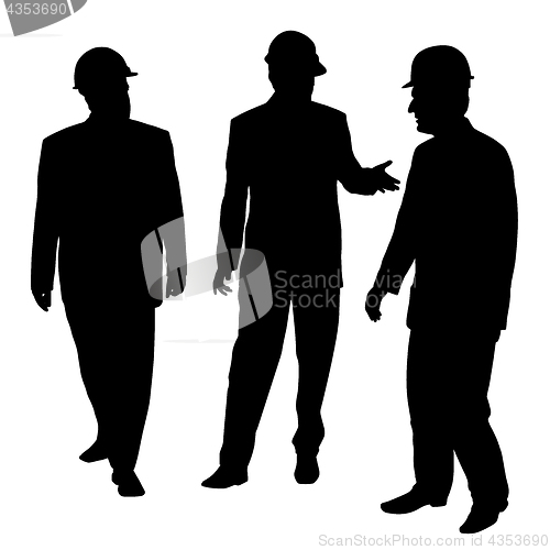 Image of Three businessmen architects engineers or workers with protectiv