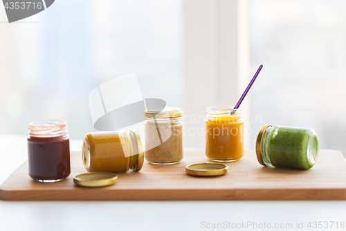 Image of vegetable or fruit puree or baby food in jars