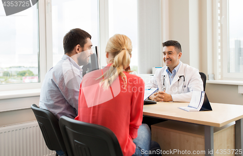 Image of couple visiting doctor at family planning clinic