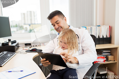 Image of doctor or pediatrician with girl patient at clinic