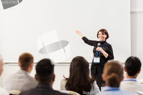 Image of group of people at business conference or lecture