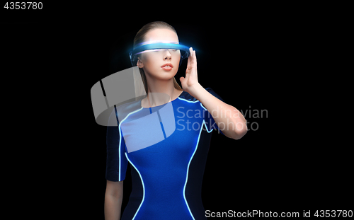 Image of woman in virtual reality 3d glasses over black