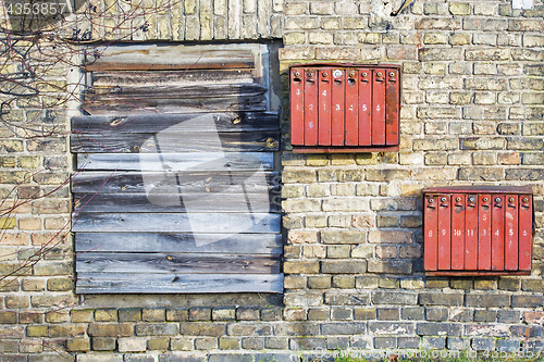 Image of Rusty mailboxes on the brick grunge wall