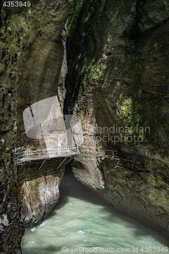 Image of A traveler shooting amazing landscape of mountain river 