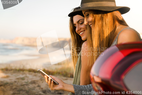Image of Girl showing something on the phone