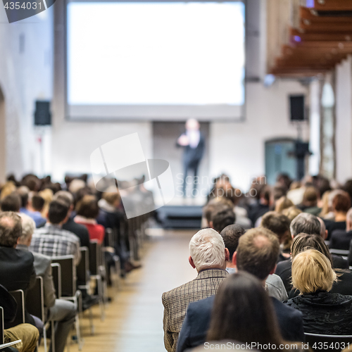 Image of Business speaker giving a talk at business conference event.