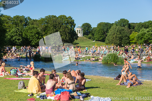 Image of People enjoying the summer day in Englischer Garten city park in Munich, Germany.