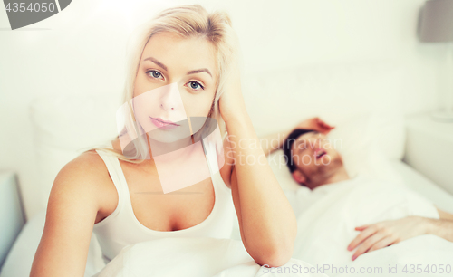 Image of awake woman having insomnia in bed