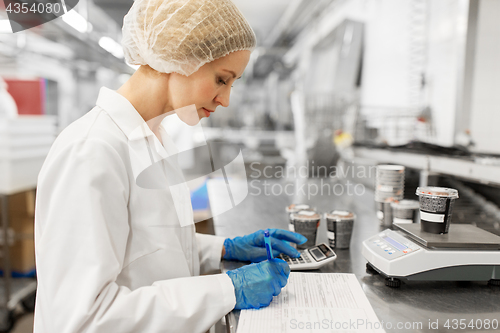 Image of woman working at ice cream factory