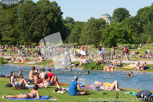 Image of People enjoying the summer day in Englischer Garten city park in Munich, Germany.