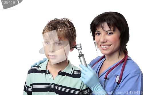 Image of Doctor checking childs ears