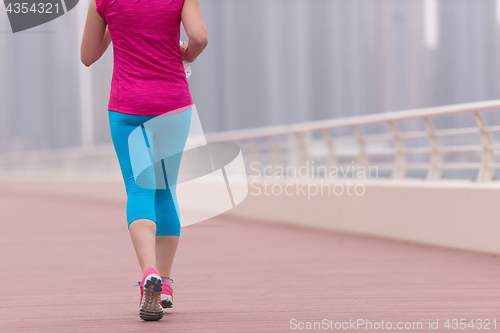 Image of woman running on the promenade