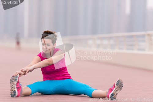 Image of woman stretching and warming up