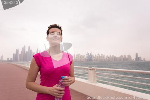 Image of young woman celebrating a successful training run