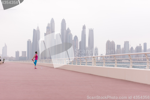 Image of woman stretching and warming up