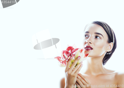 Image of young pretty brunette woman with red flower amaryllis close up i