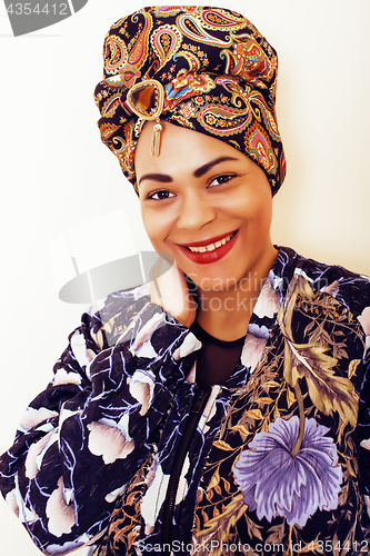 Image of beauty bright african woman with creative make up, shawl on head like cubian closeup smiling, cheerful tan mulatto, lifestyle people concept