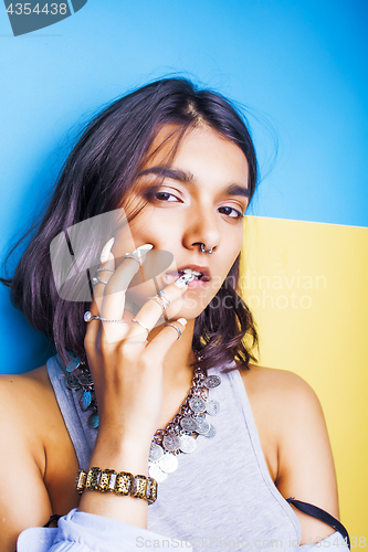 Image of lifestyle people concept. young pretty smiling indian girl with long nails wearing lot of jewelry rings, asian summer happy cool