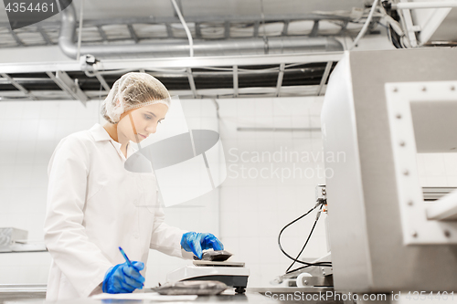 Image of woman working at ice cream factory