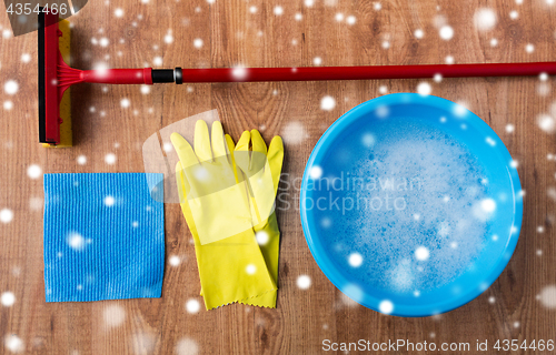 Image of squeegee with window cleaning stuff on wood