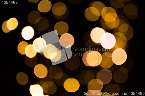 Image of blurred golden lights over dark background