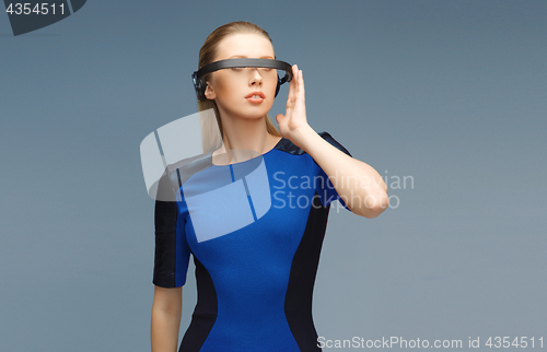 Image of beautiful woman in virtual reality 3d glasses