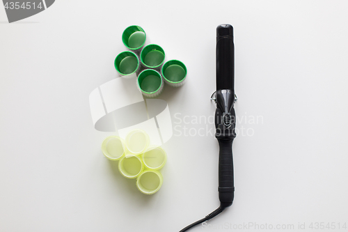 Image of curling iron or hot styler and hair curlers