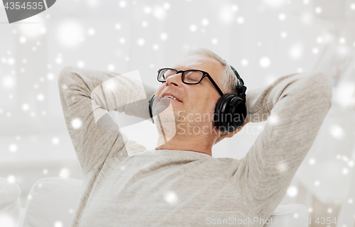 Image of happy man in headphones listening to music