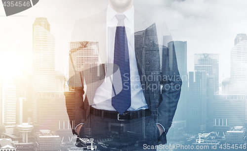 Image of close up of businessman over city buildings