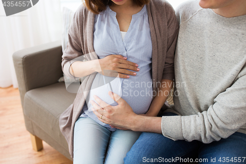 Image of close up of man and pregnant woman